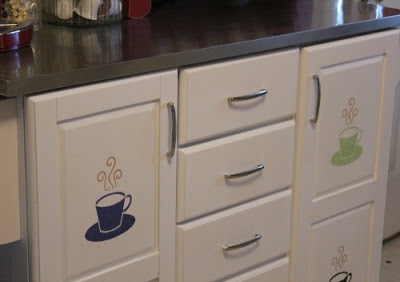 The stenciled cups of coffee I painted on the rescued white kitchen cart