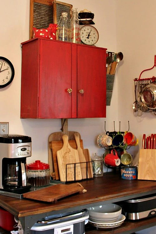 Apartment kitchen #3 came with a red cupboard I found at the antique mall, which gave me extra storage. The wooden cart has my coffee bar.