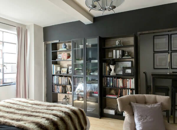 In Studio Apartment In NYC, you see Angie's bookcases