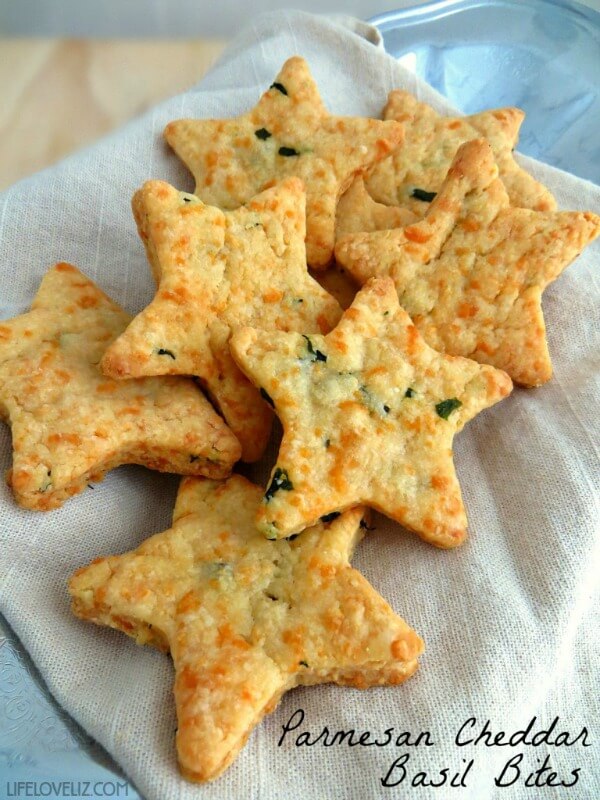 In 10 Christmas-Themed Appetizers, this particular appetizer called Parmesan Cheddar Basil Bites is by Life Love Liz.