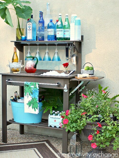 In 10 Small Space Entertaining Tips, this outdoor potting bench can serve as a place to serve food from.