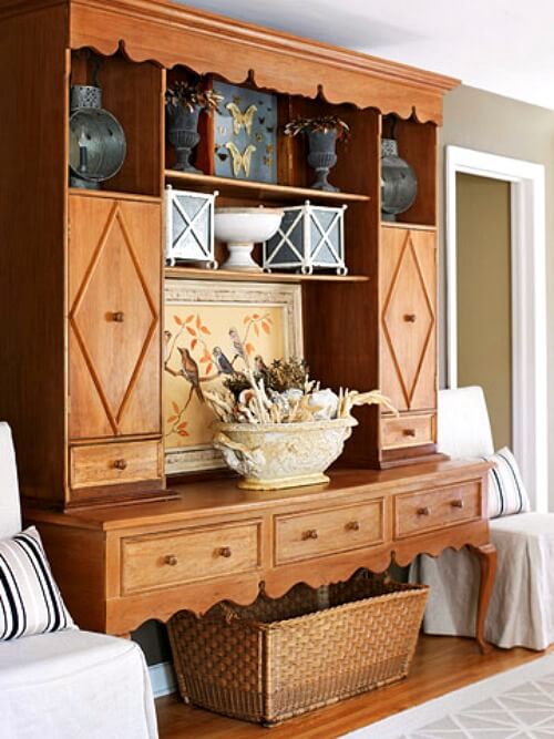 In Small Midwestern home with European style, this piece of furniture features a light brown stain.
