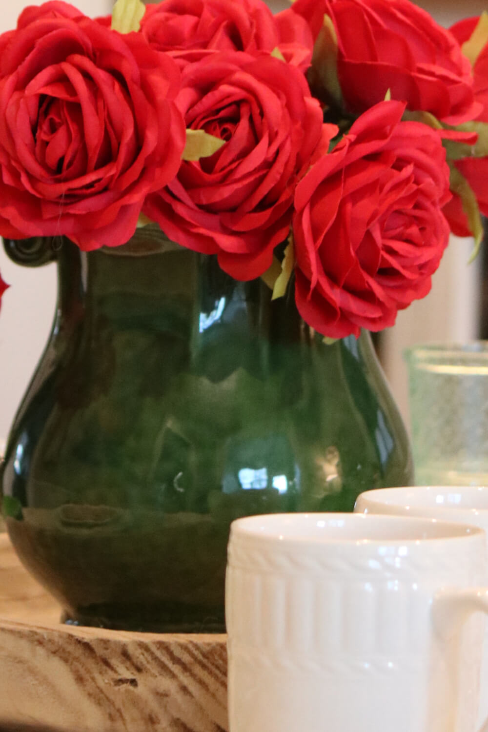 Faux roses in my green pitcher as a centerpiece.