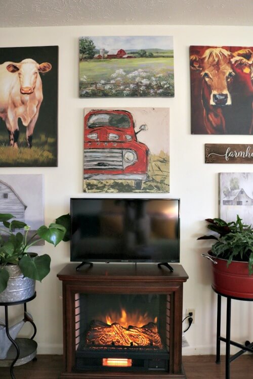 The gallery wall above the fireplace is soothing to stare at when the fireplace is going.