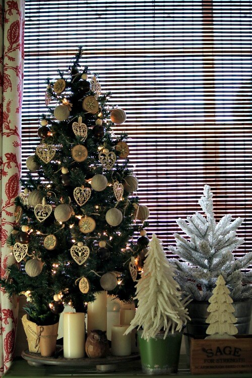 In A Boho Christmas Tree Vignette,