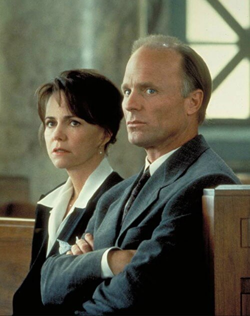 In an eye for an eye, Sally Field and Ed Harris are sitting in the courtroom in the movie