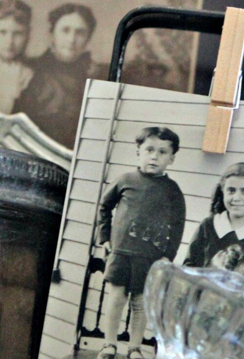 Vintage photos clipped to an old cheese grater