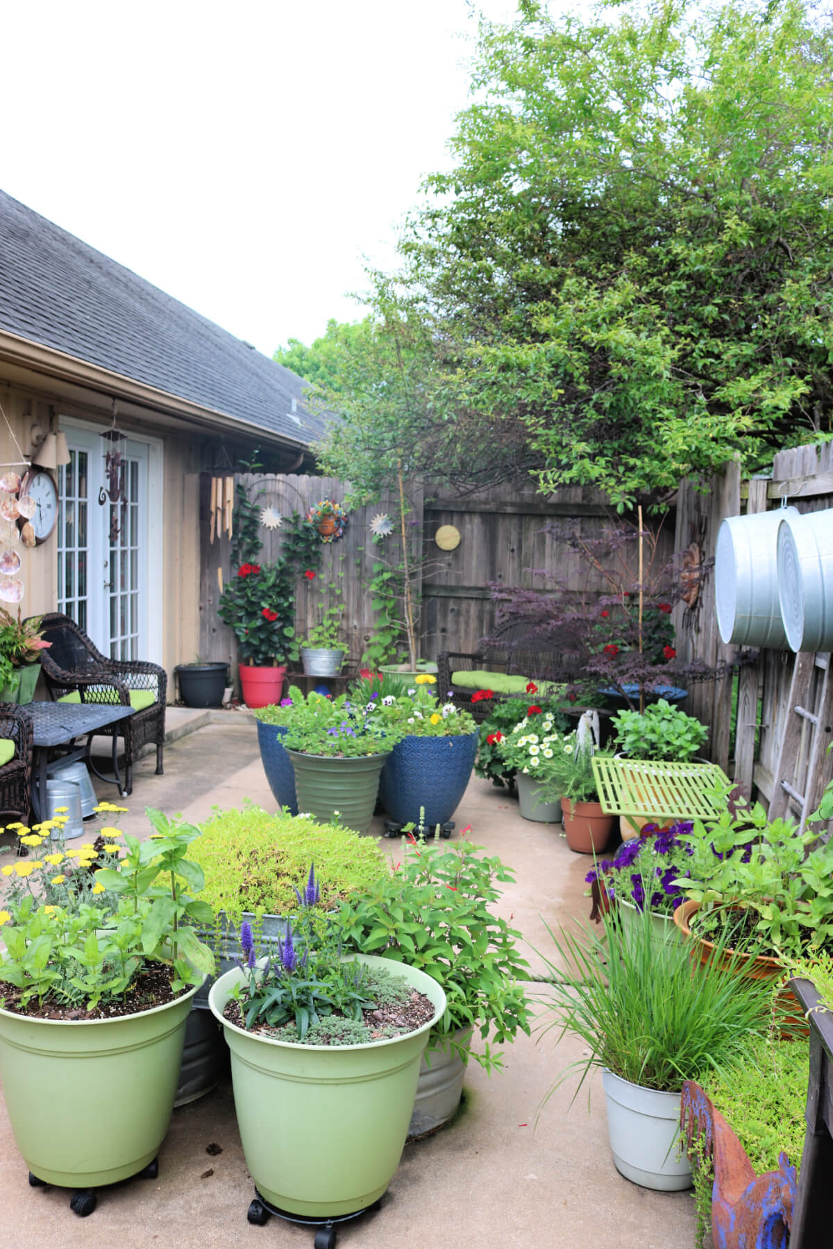Gardening on a patio or balcony expands your living space. Add seating so you can sit and enjoy your work.