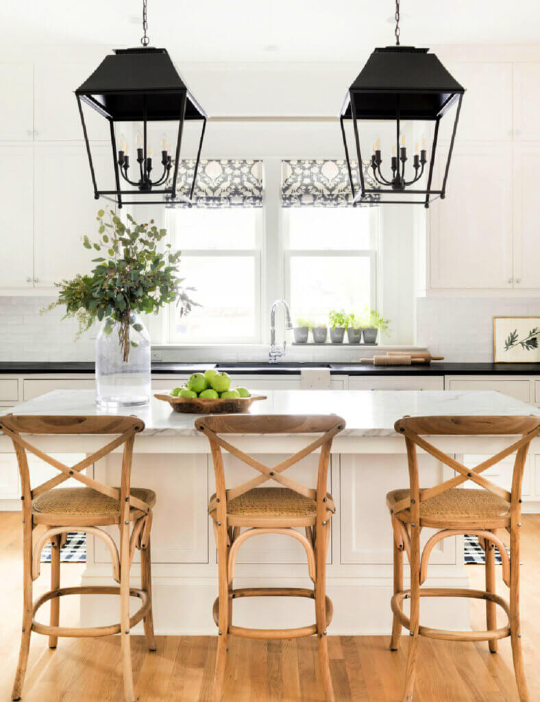 White kitchen with wood bar stools