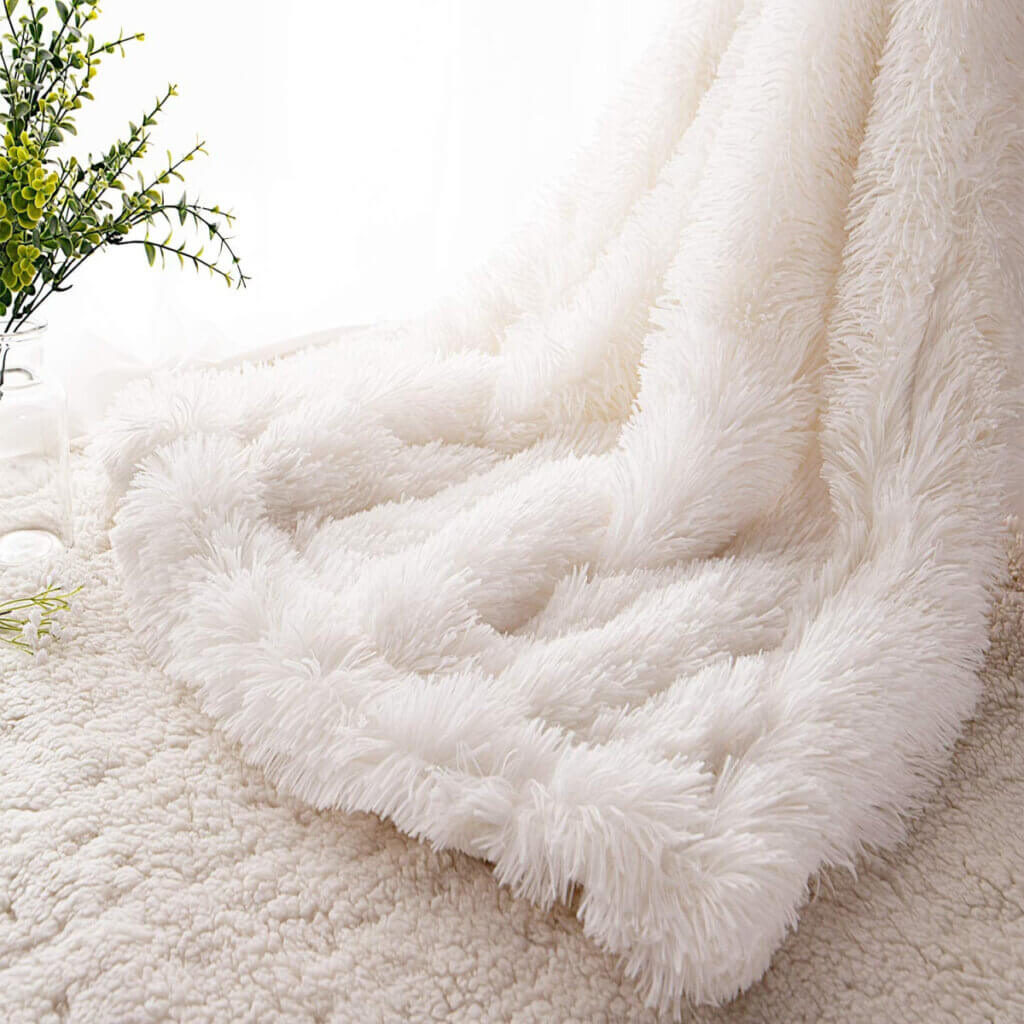 Ramp up the cozy for fall with this fluffy white throw