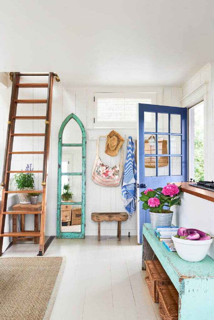 In Stunning Summer Retreat On Martha's Vineyard, the bright blue door of their home coming inside