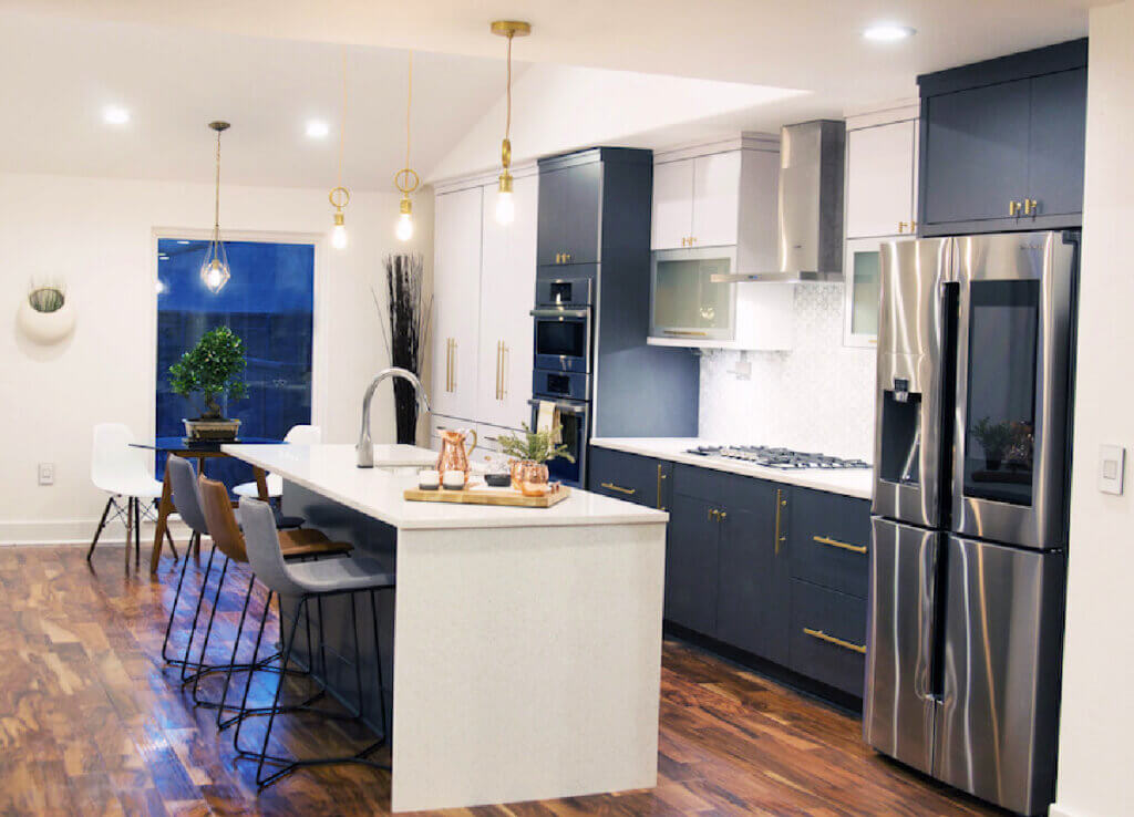 The couple who flipped this house painted the kitchen cabinetry navy blue