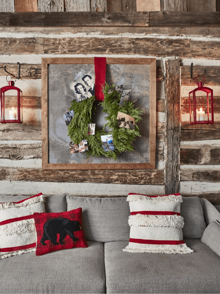 In a Tennessee Log Cabin Christmas there is a wreath with old family photos clipped to it