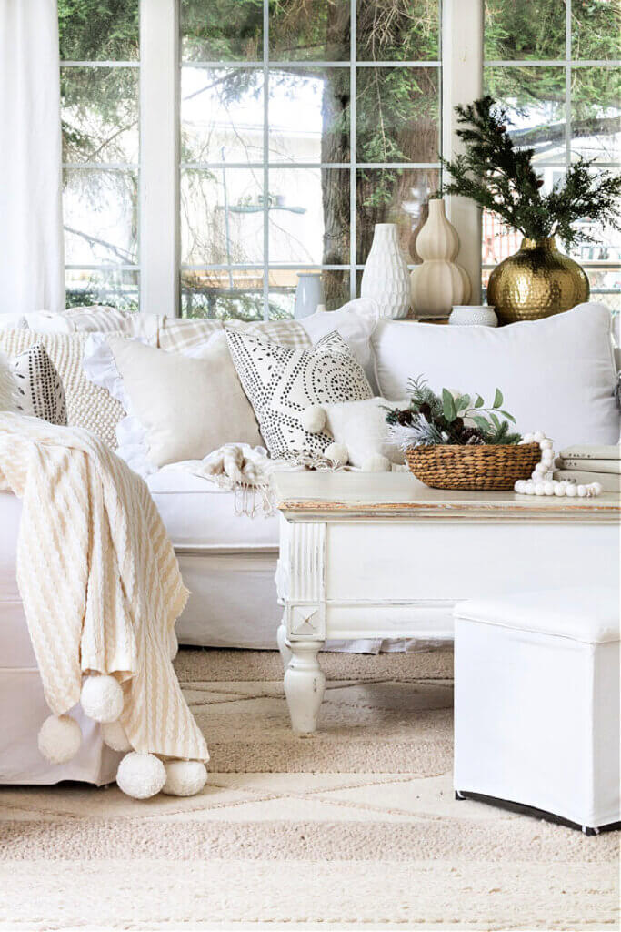 In Easing Into Winter Decorating, the whites and beige in this room feel warm and cozy