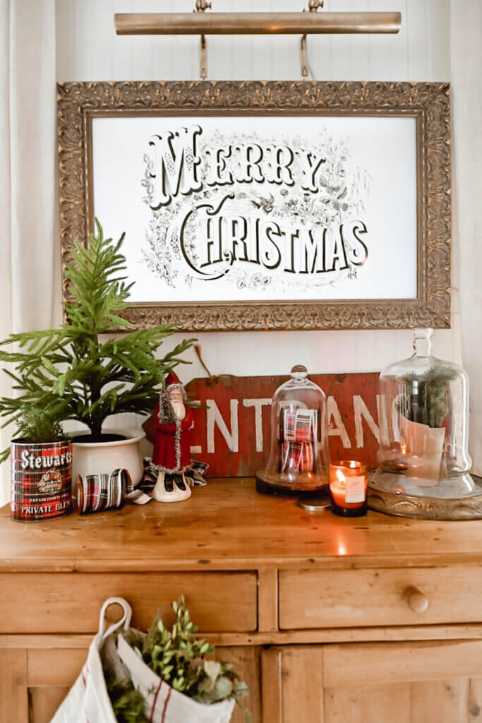 This blogger created a Christmas vignette on a surface of furniture.