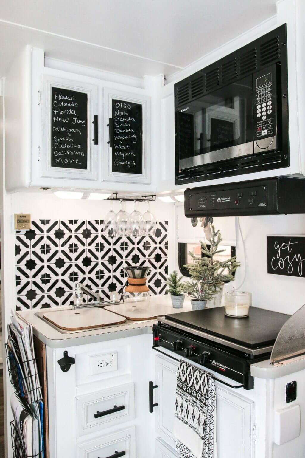 RV kitchen at Christmastime in black and white.