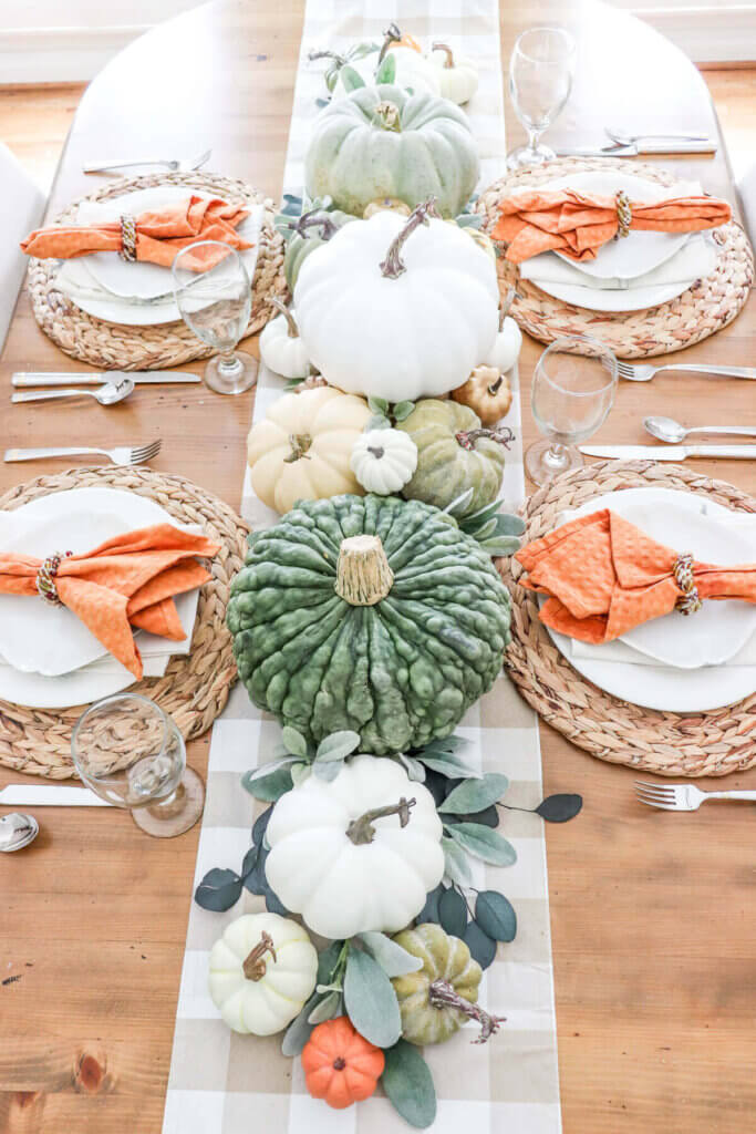 A green, beige and orange fall tablescape