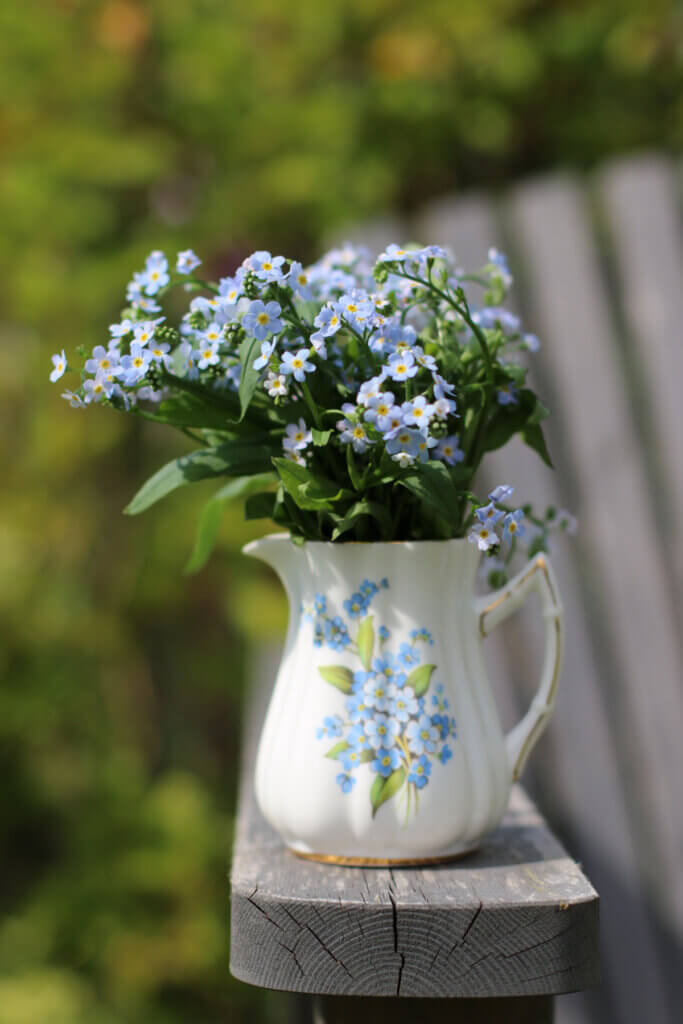 In if a chair can paint a thousand words, I think of this pitcher with blue wildflowers