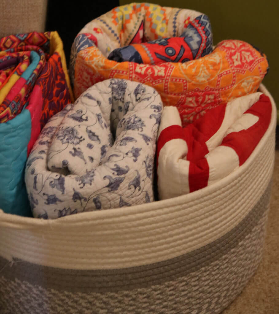 In What To Do With That darned Mirror, I show a boho basket filled with rolled up quilts