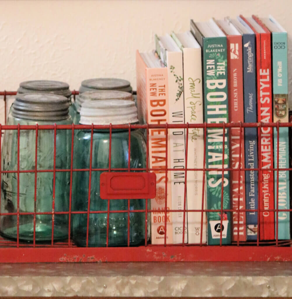 In Update On Gracie & A New Interactive Cat Toy, here is a red farmhouse container with books and vintage mason jars.