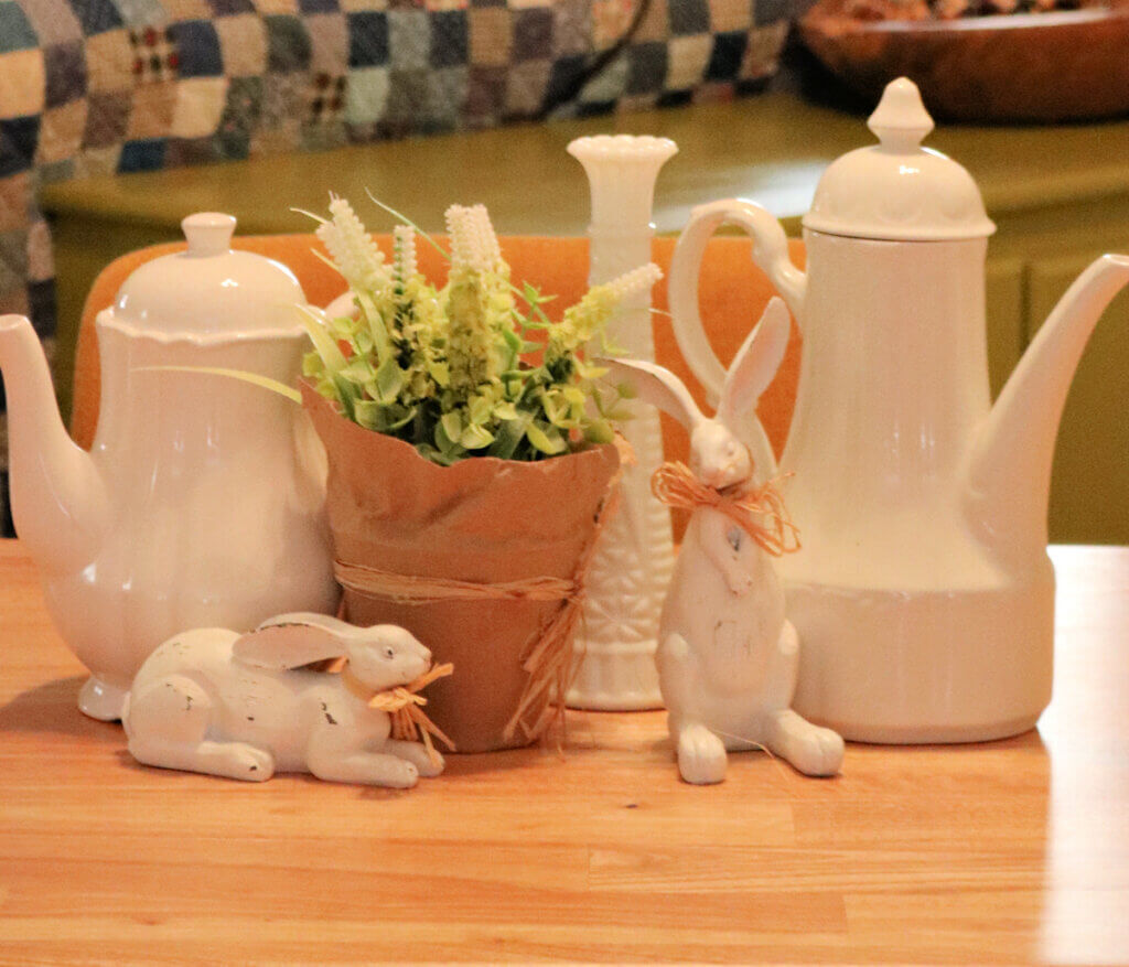 In Easter/Spring Table Centerpieces, here's one I created with white pitchers and other decor.
