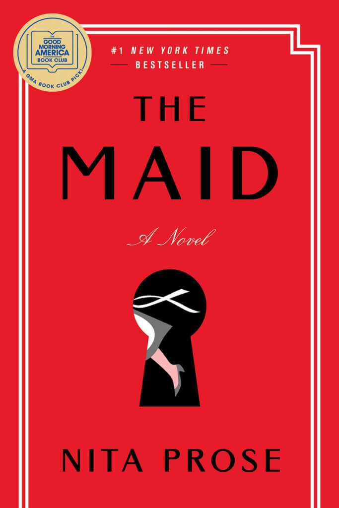 The hardback book "The Maid" by novelist Nita Prose which I'm currently reading.