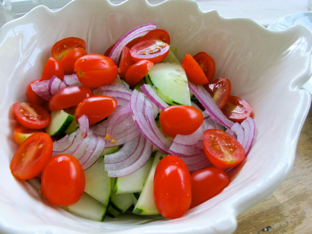 Cucumber, Tomato and Feta salad is both filling and frugal to serve on July 4th