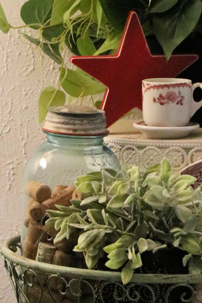 In this Red & White Plant Stand Vignette, I used two Mason jars for decor.