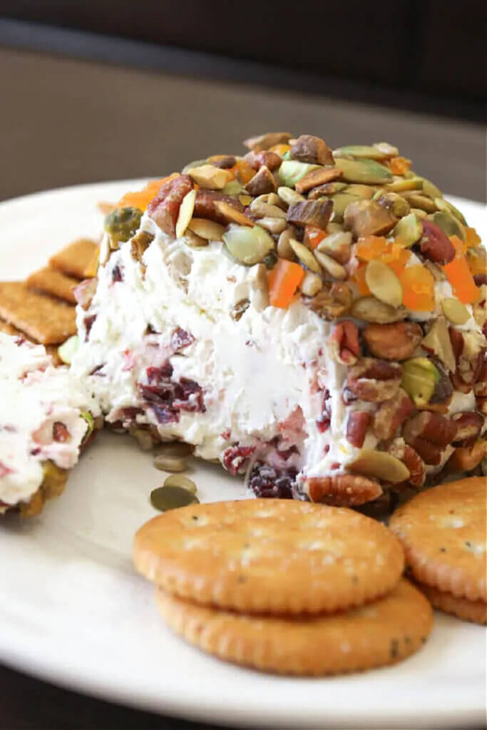 A harvest cheese ball coated with healthy nuts and fruits.