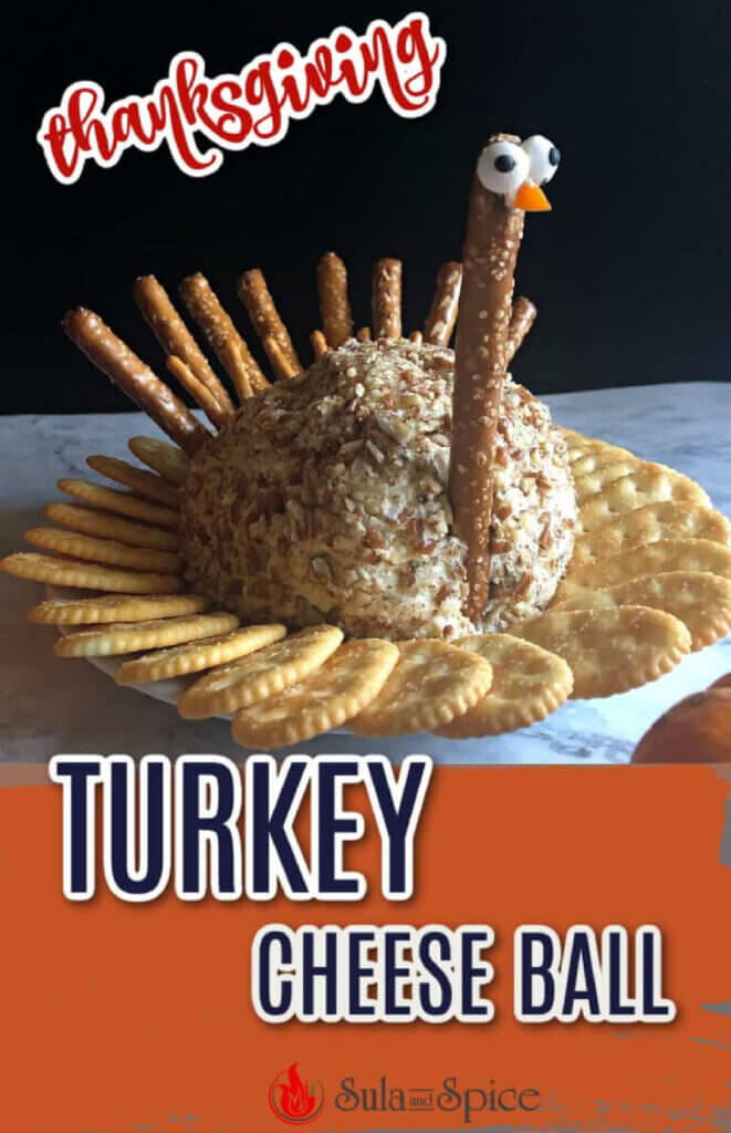 In 8 Thanksgiving Themed Cheese Ball Recipes, this turkey cheese ball is shaped like a turkey surrounded by crackers.
