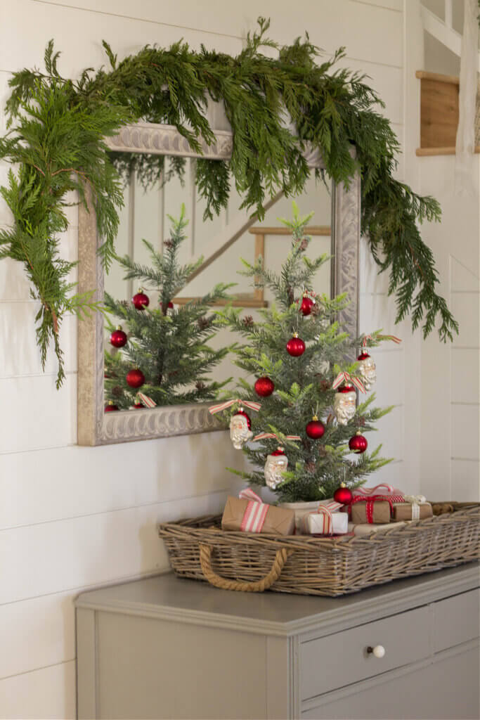 A small Christmas tree on a foyer tabletop