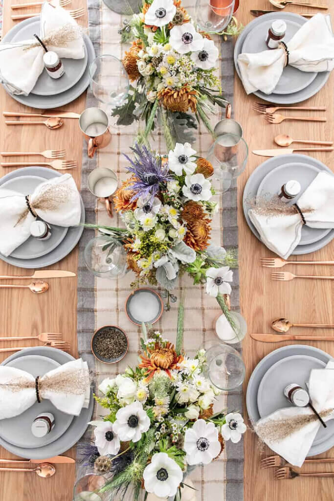 In Thanksgiving table inspiration for 2022, the blogger at Sugar & Cloth shows her holiday table setting.