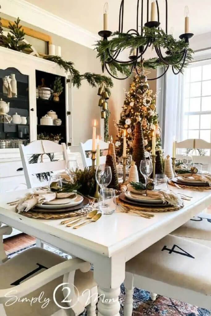 A neutral Christmas-themed dining table with dinnerware
