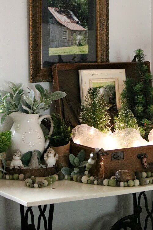 A vignette I created for the winter months using a vintage suitcase.