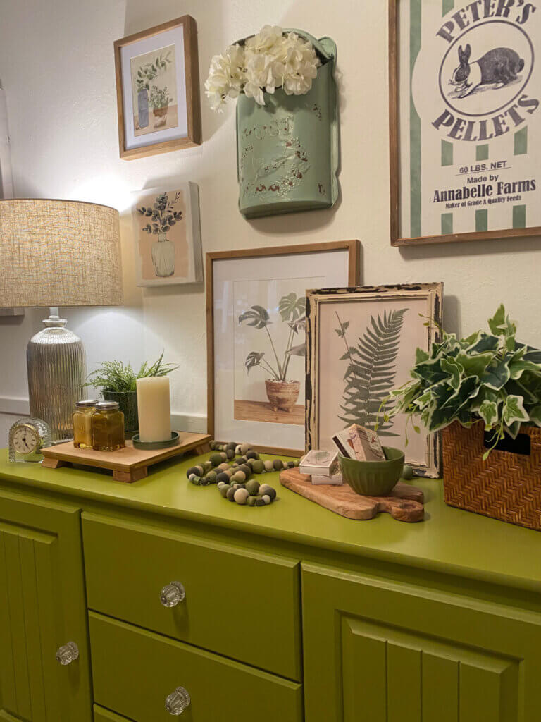 In Decorating With Shades Of Green For Spring, I found all kinds of things around my apartment to use on this sideboard in my dining space