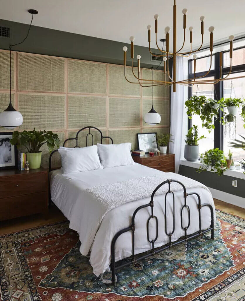 In Displaying House Plants In Your Home, this is a bedroom with white linens and many plants