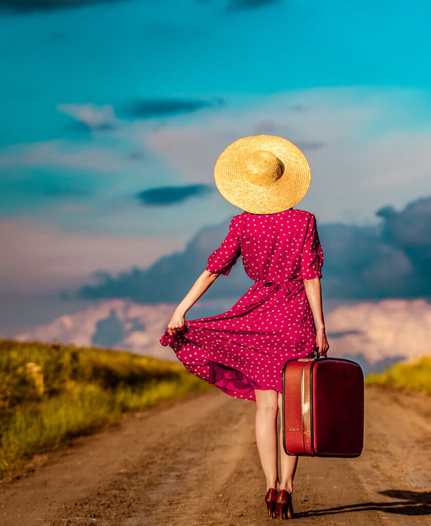 In Divorce & Women Over 50, this is an image of a woman walking away with her suitcase.