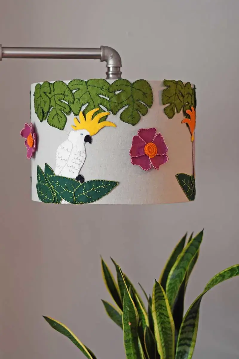 In How To Embellish Lamp Shades, this one is made with felt shapes