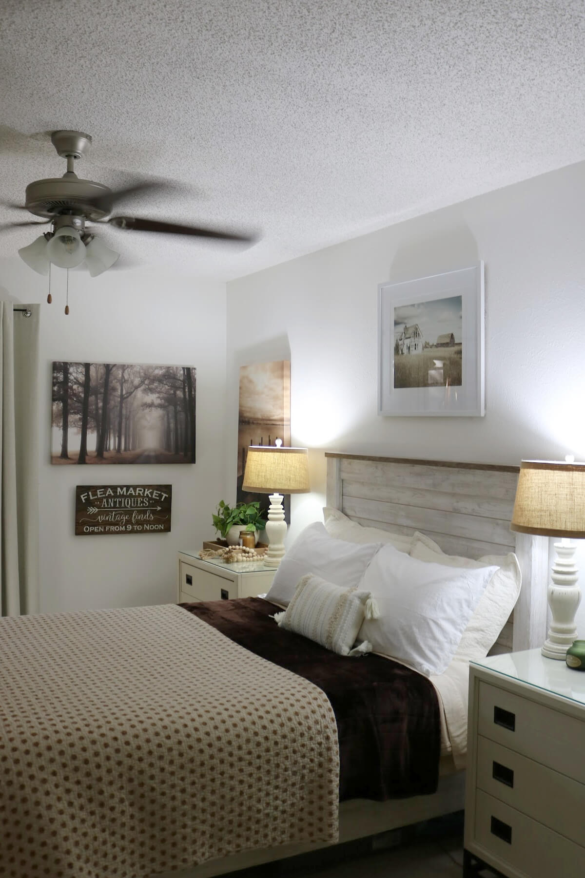 My bed with four pillows and a boho throw pillow.