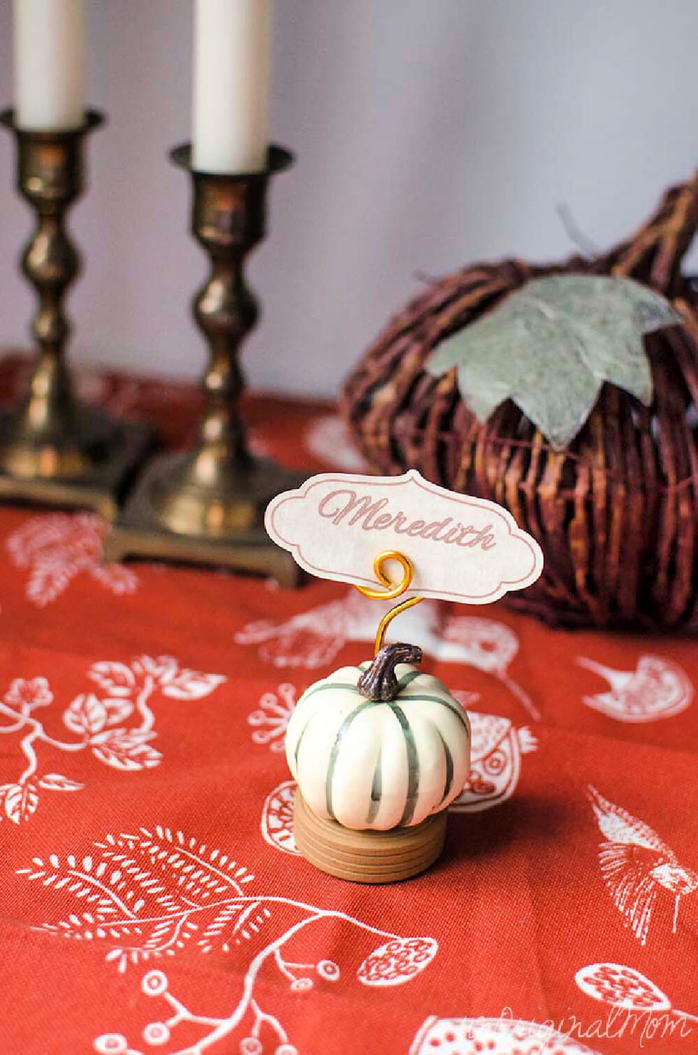 In 10 Thanksgiving Place Card Ideas, Faux pumpkin has a name attached
