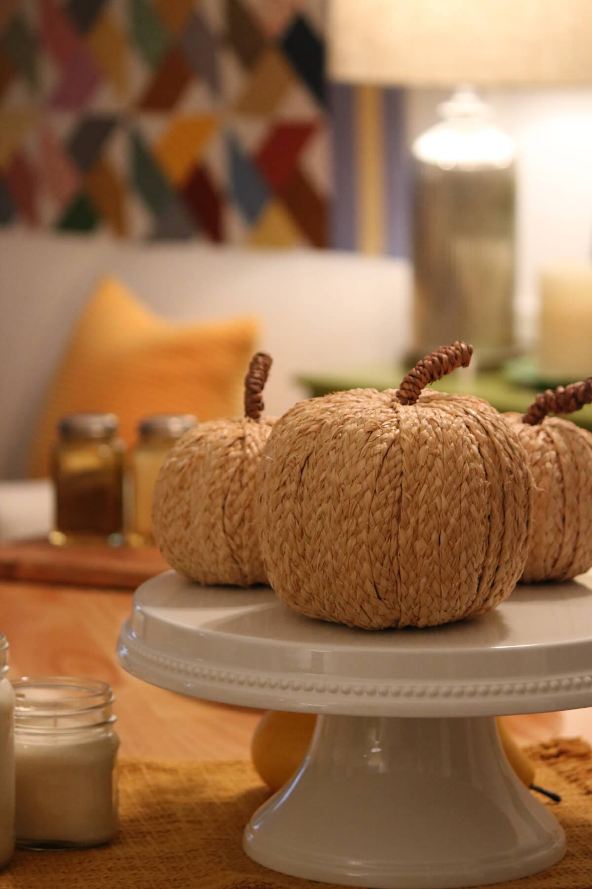 In Cozy Minimalist Fall Decorating, textured pumpkins on a cake plate