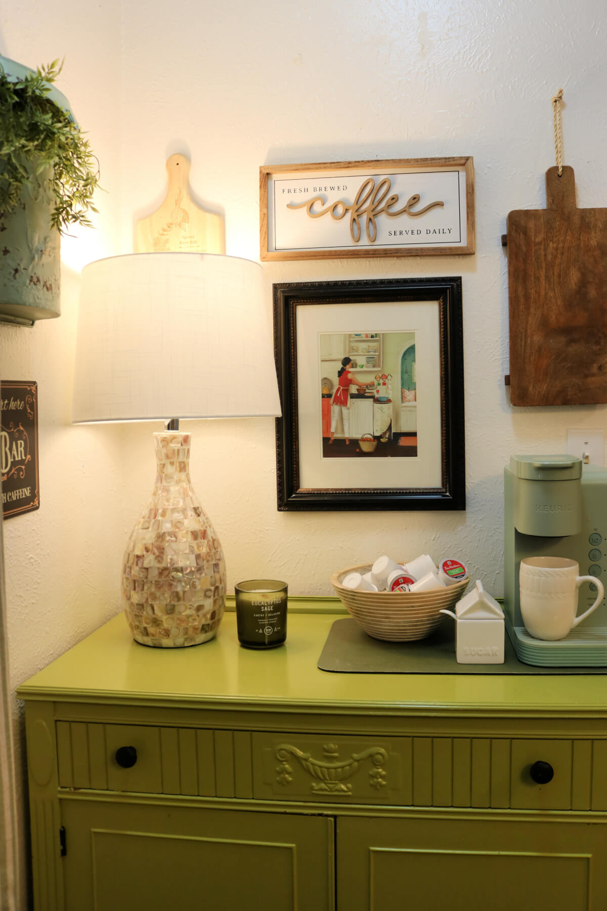 Front view of the corner of the kitchen that includes my coffee bar on a sideboard