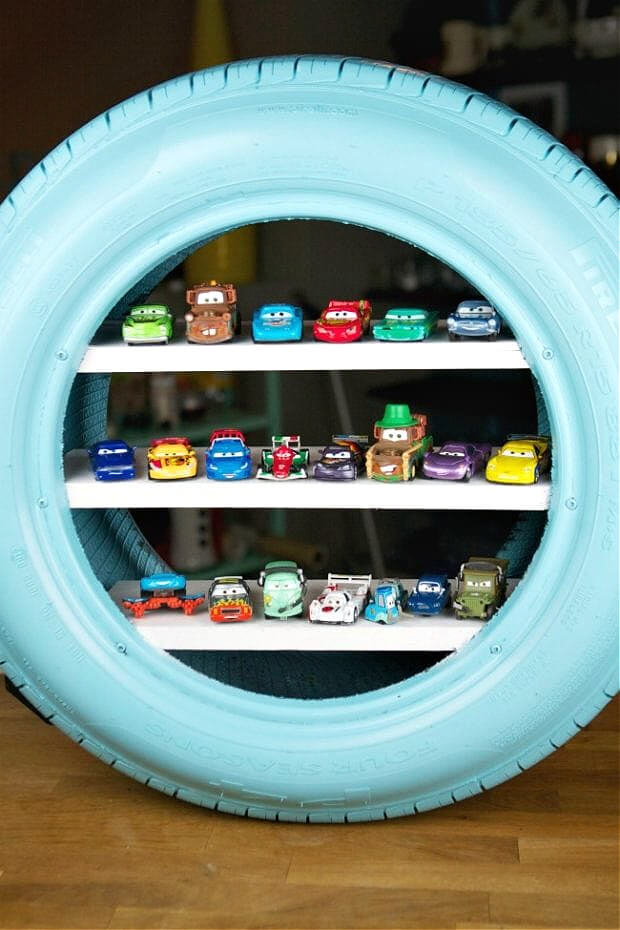 In 10 Unusual DIY Shelves, an old tire painting and turned into a place for a little boy to store his toy cars.