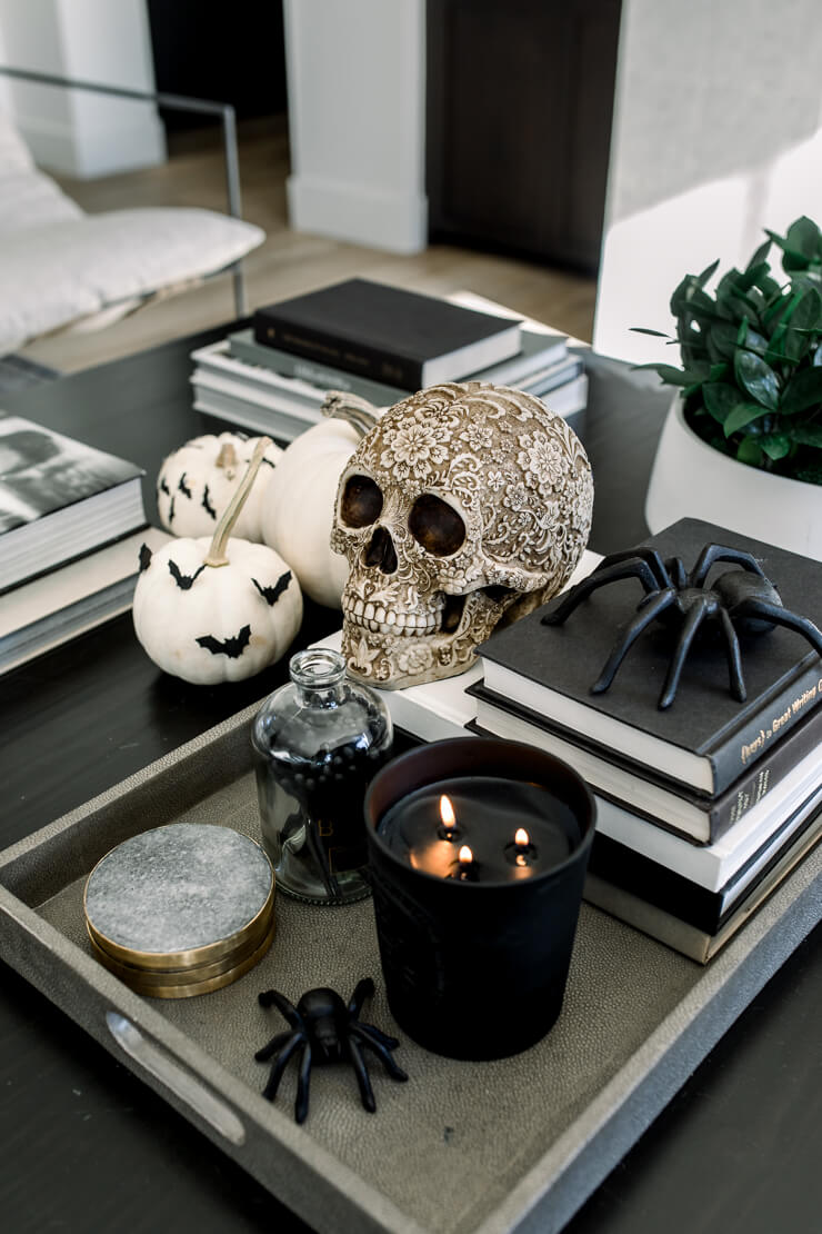 In 8 Neutral Halloween Decorating Ideas, this is a coffee table filled with all things Halloween.