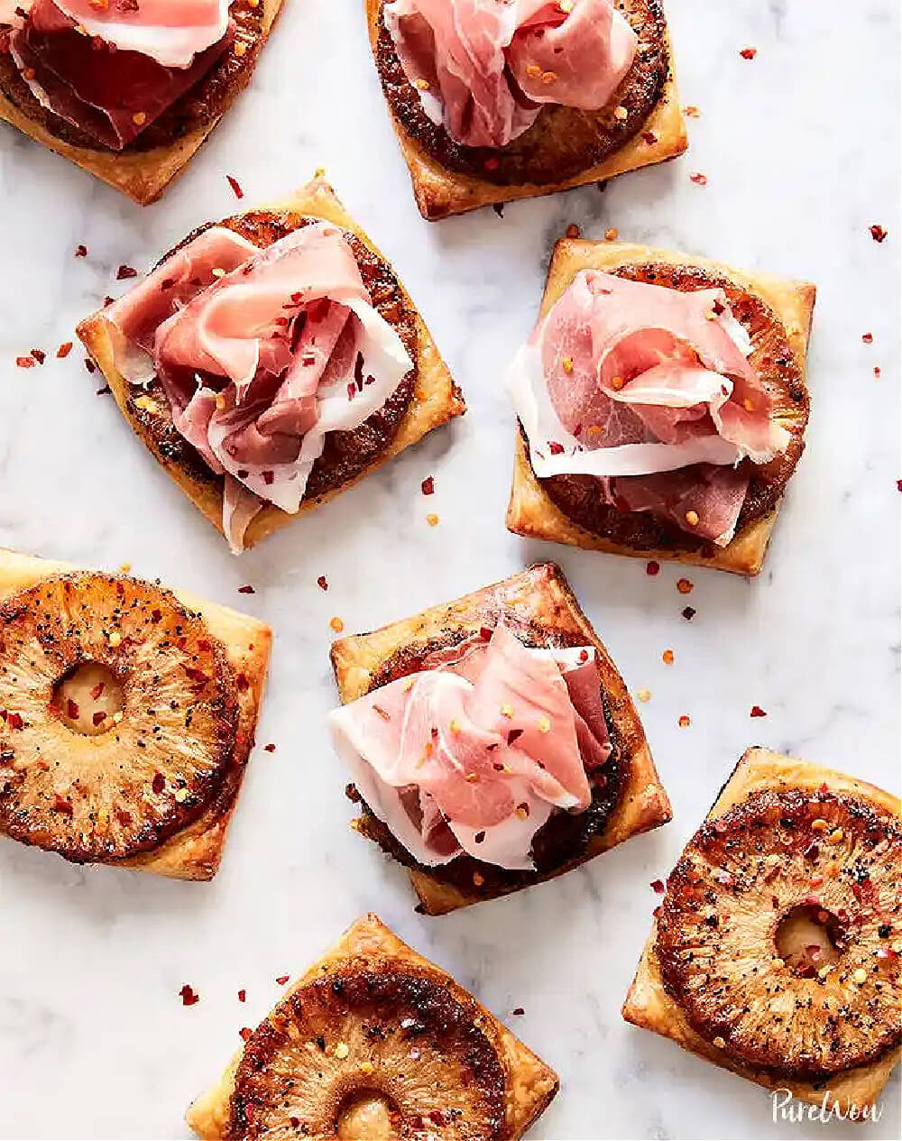 In 10 Delightful New Year's Eve Appetizer Recipes, this is Spicy pineapple prosciutto tarts