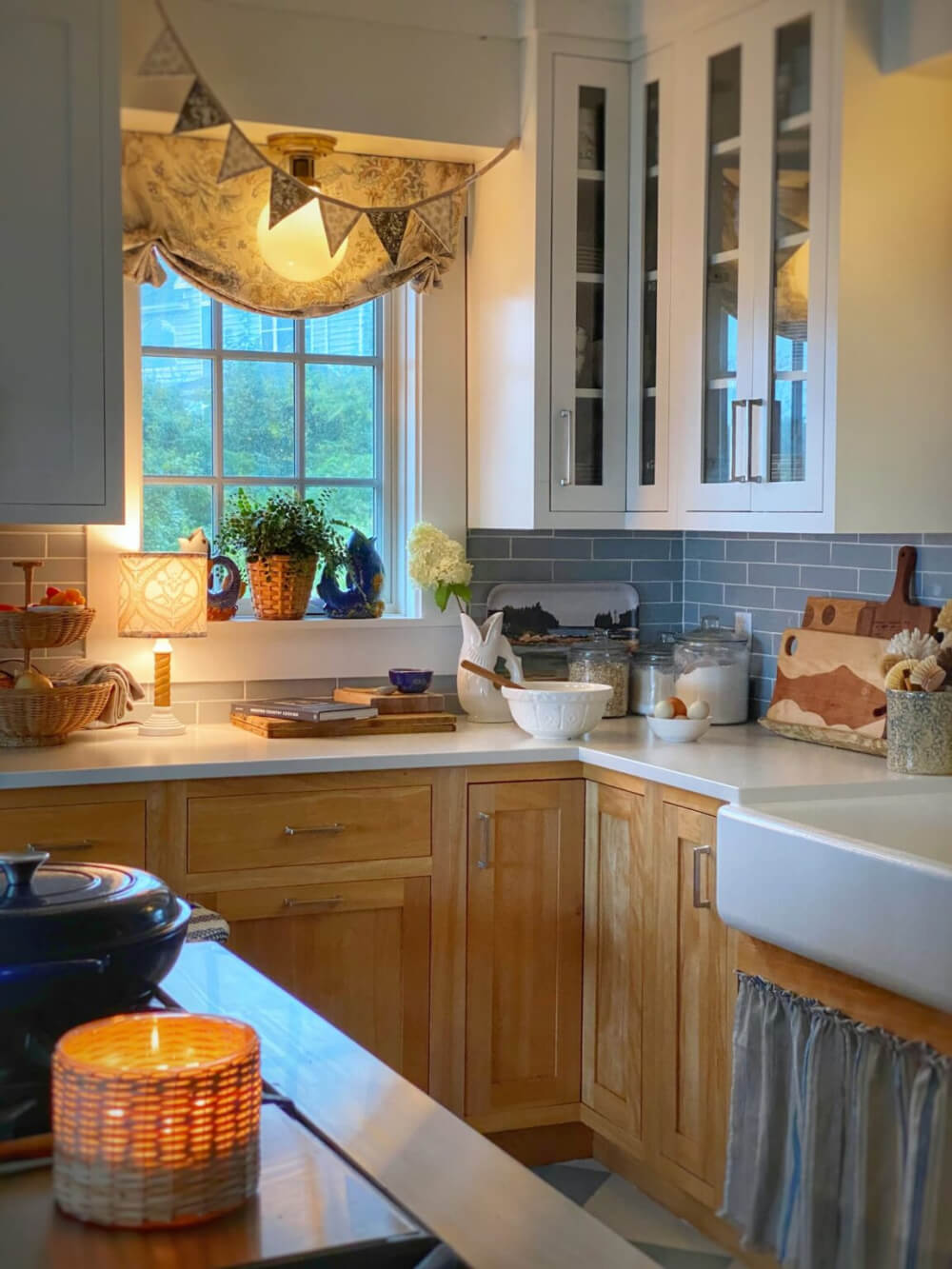 A cozy blue and white and light wood kitchen