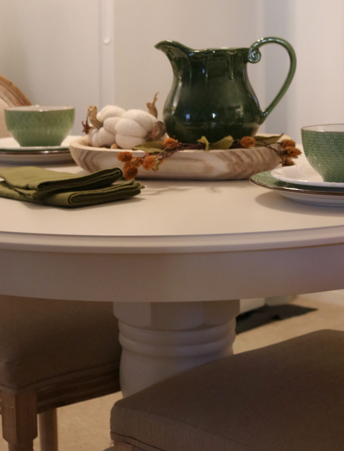 In Tablescape On A New Dining Table, everything on the table is green and cream.