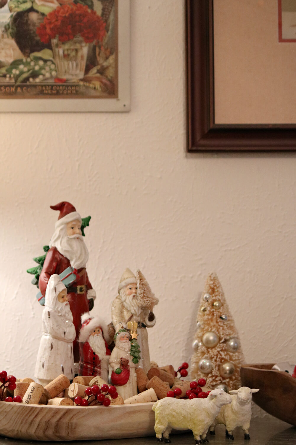 In Dining Room Santa Vignettes, Holiday vignettes on the sideboard along the dining space wall