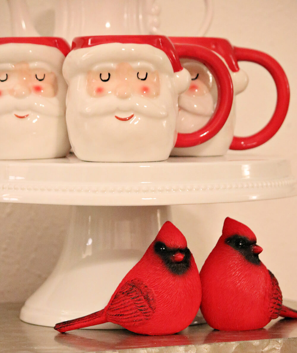 In Dining Room Santa Vignettes, two male cardinals under a cake stand