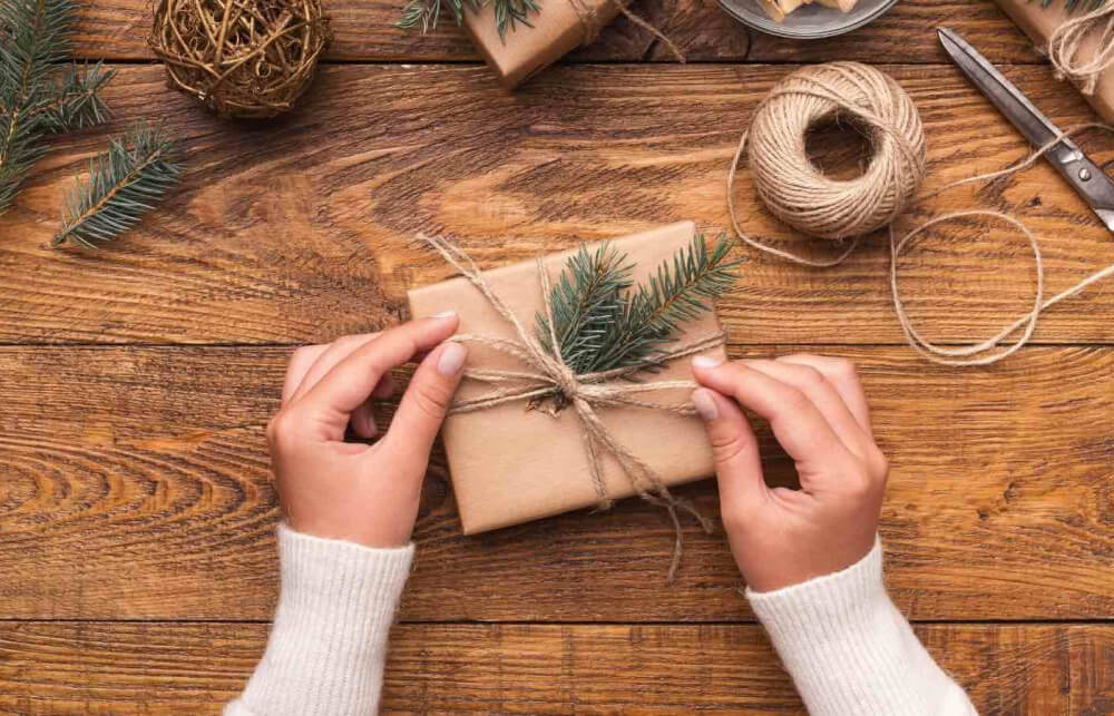In 8 Unique Eco Friendly Gift Wrapping Ideas, this gift is wrapped in kraft paper with greenery tied on with jute